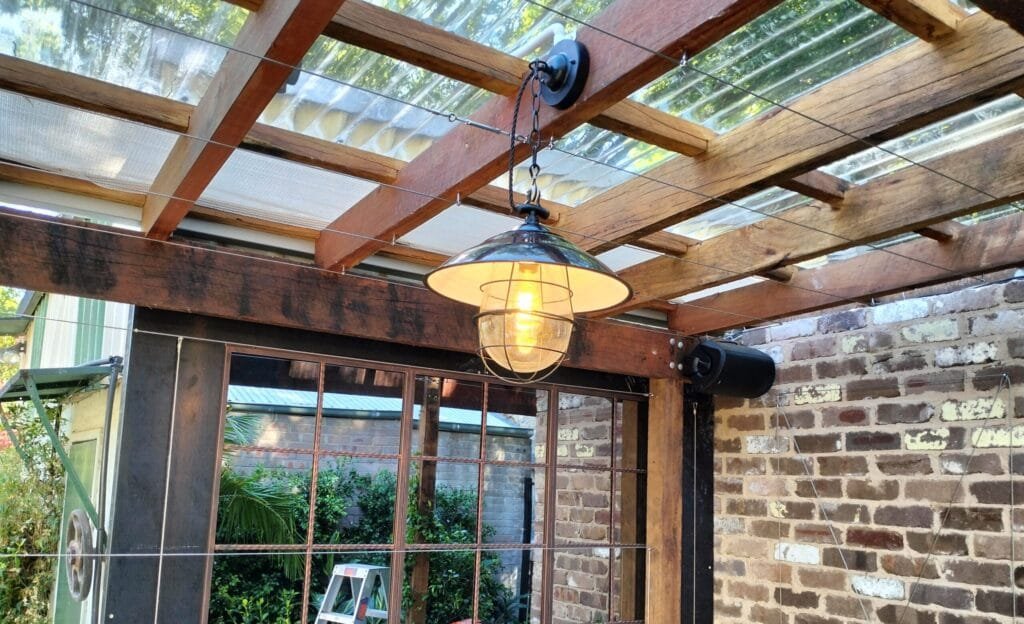 oplus_0 a antique pendant light hanging in pergola